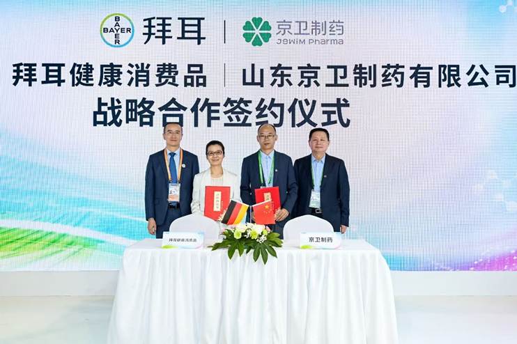 A group of people standing in front of a signAI-generated content may be incorrect.