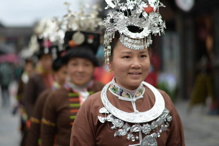 A Chinese villager of Miao ethnic group wearing traditional costumes  practises ''Miao stickfighting'', a unique martial art of the Miao Martial  Arts i Stock Photo - Alamy