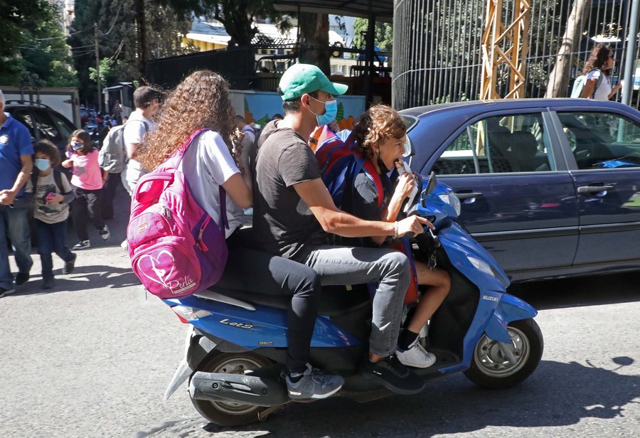 Mideast in Pictures More Lebanese families resort to motorbikes for