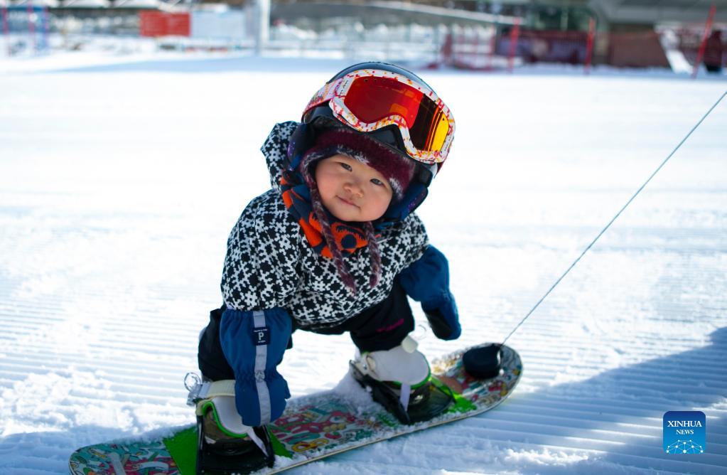 11monthold baby girl practises skiing at Thaiwoo Ski Resort in China