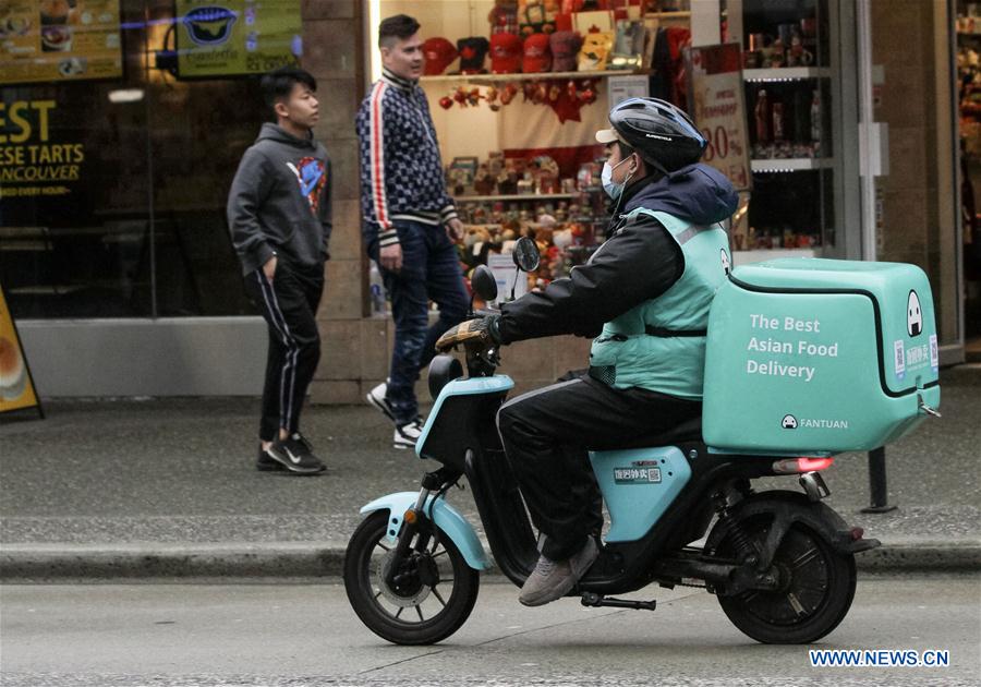 Food deliverymen rides in Vancouver, Canada Xinhua English.news.cn