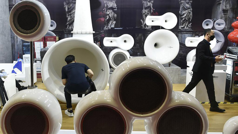 People visit booths of global businesses attending CIIE