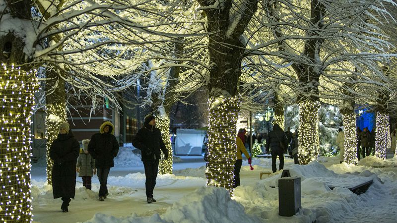 People enjoy Christmas lights in Ogre, Latvia