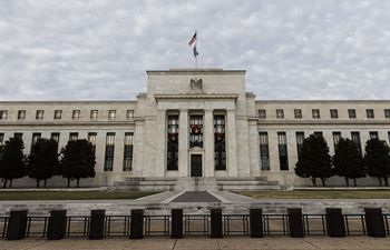 U.S. Fed announces faster tapering of asset purchases, projects three rate hikes next year