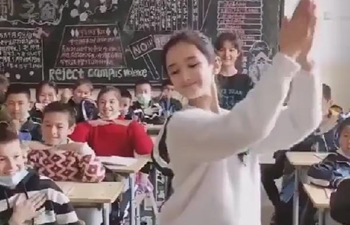 Xinjiang girls dance at classroom