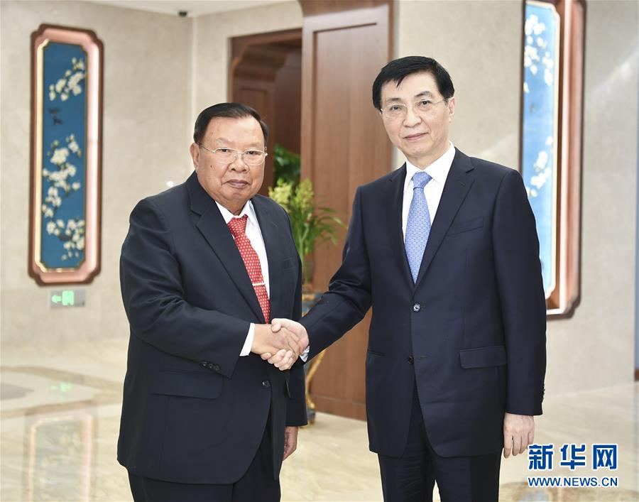 （时政）王沪宁会见老挝人民革命党中央总书记、国家主席本扬